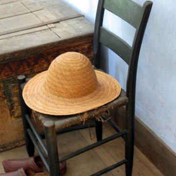 Straw Hat, Shoes And An Old Chair.
