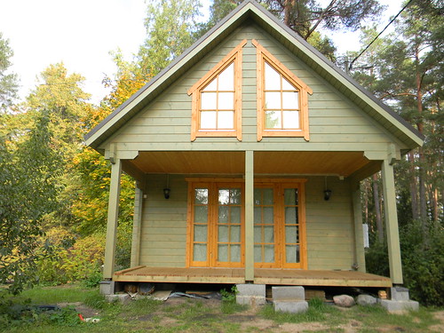Front of tall log cabin