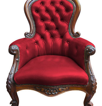 vintage red leather armchair on white with clipping path