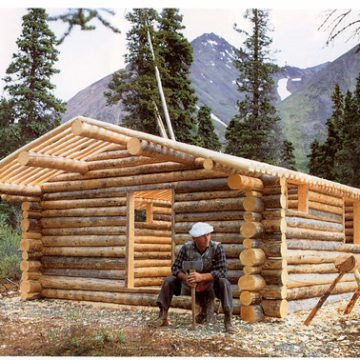 dick-in-front-of-cabin-mid-build