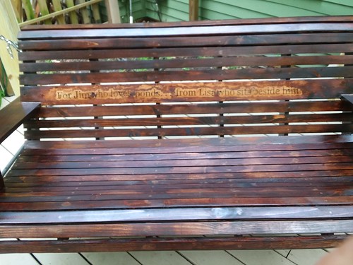 My diy porch swing with stained inscription: