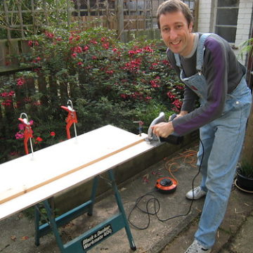 Day 5: Me wielding the circular saw in the garden