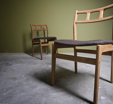 A pair of wooden dining chairs