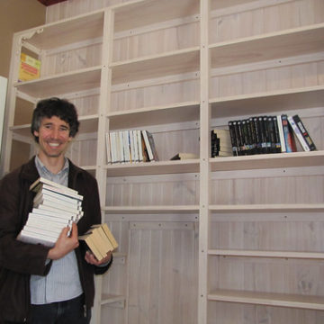 Brett Loading His Bookshelf - Strawbale House Build in Redmond Western Australia