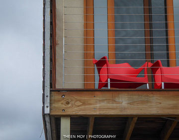Red Chairs on Wooden Deck