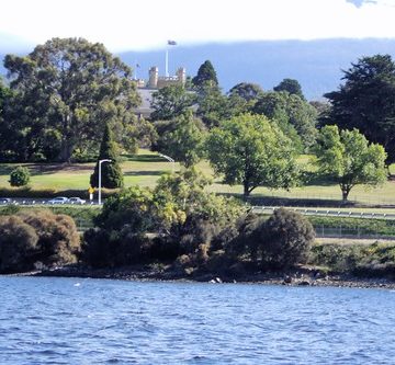 Hobart. A partial view of the Gothic Government House of Tasmania from the Derwent River.
