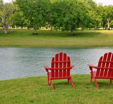 Red Chairs, Green Grass, Blue Water